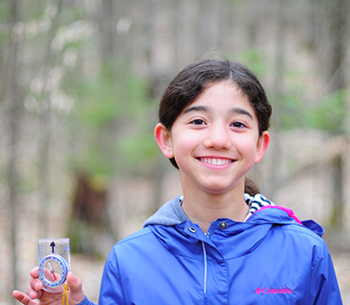 Girl holding a compass