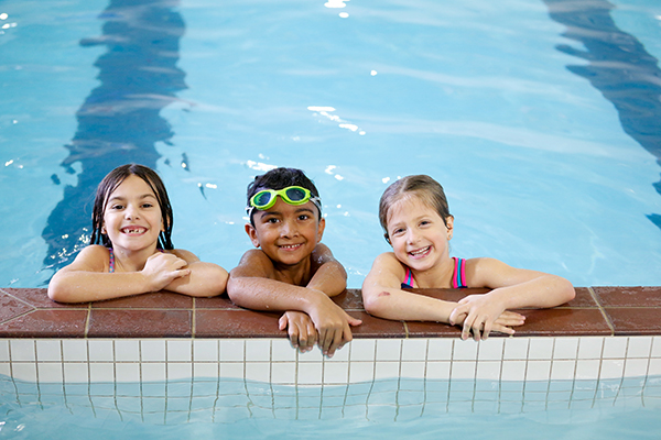 Primary children enjoying the swimming pool