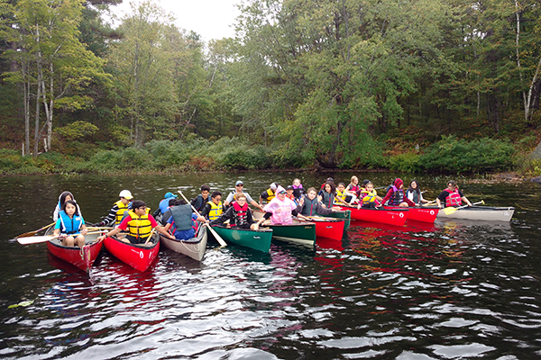 Grade 8 students at the Outdoor Education Centre taking a break from canoeing