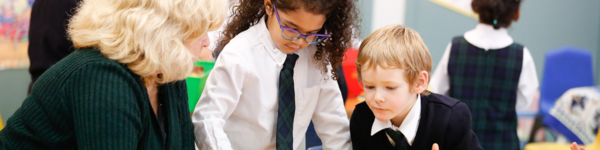 JK teacher working with two JK children