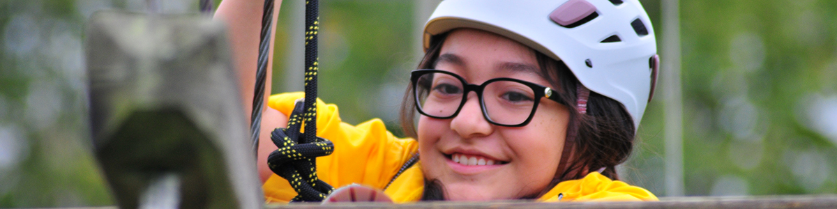 Girl using the high ropes course