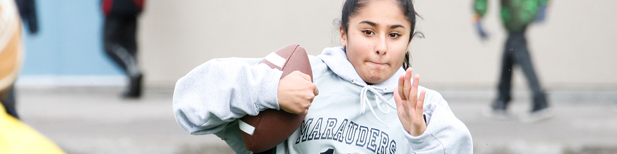 Intermediate Division girl playing football